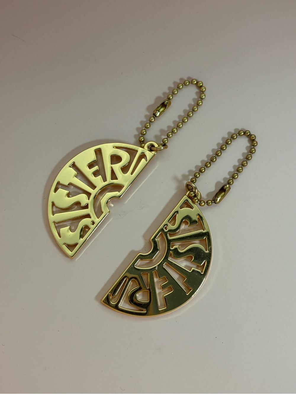 Nike Gold-tone Half Moon Pendant Keychains - Set of 2